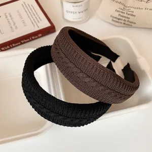 Knitted wide headband set in black and brown with thick vintage cable knit texture