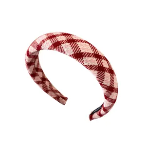 Thick red and pink plaid headband in textured woven fabric for a high-volume hair look