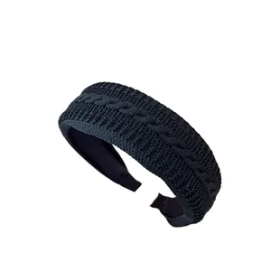 Knitted wide headband with vintage cable pattern in solid black color for women