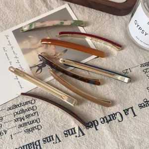 Set of 8 slim acetate hair clips in vintage amber and marble patterns with gold metal clips