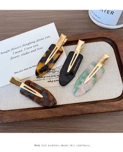 French vintage style acetate hair clips set in marble and tortoiseshell patterns