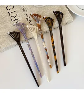 Detail showing five-piece acetic acid hair pins with fan-shaped cutout and pearl accents