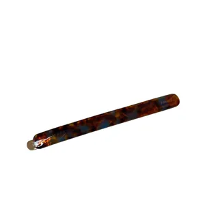 Slim tortoise acetate barrette hair clip with France handmade engraving on white surface