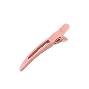 Pink matte hair root volumizing clip for high cranial top and seamless styling fix