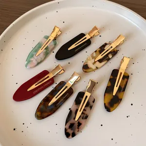 Set of 7 colorful acetate teardrop hair clips with vintage marble and leopard patterns