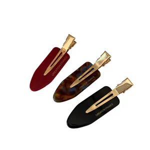 Three-piece colorful acetate geometric hair clip set in red, black, and leopard print