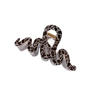 Brown leopard print wavy hair claw clip with silver glitter finish for women