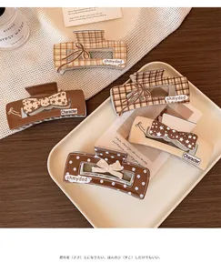 Detailed set of five brown checkered hair claw clips for women with various elegant patterns