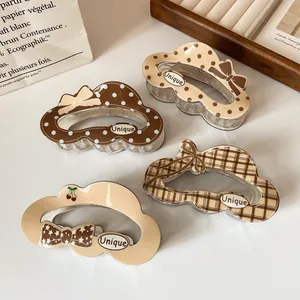 Set of four cute Korean style hair claws in beige and brown with unique patterns