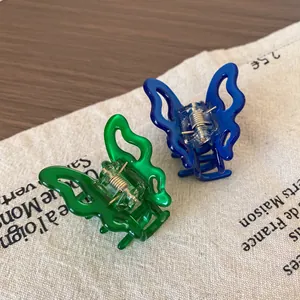 Pince à cheveux papillon en acétate bleu et vert pour des coiffures élégantes