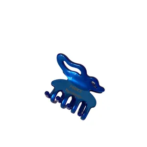 Pince à cheveux papillon en acétate bleu foncé avec design ondulé brillant