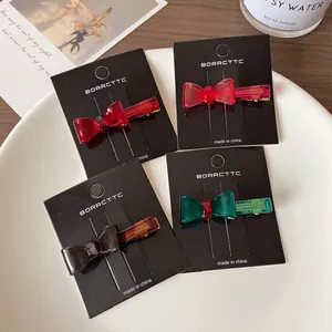 Set of four colorful transparent resin bow hair clips in elegant duckbill style