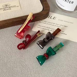 Colorful translucent acrylic bow hair clips in red, amber and green for women and girls