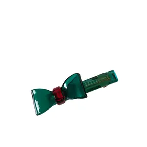 French handmade transparent green bow hair clip with a ruby red center jewel accent