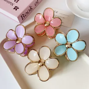 Set of four gradient flower hair clips with gold edges in pink, purple, blue and beige