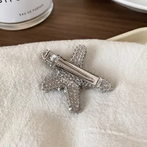 Elegant silver starfish hair clip with sparkling rhinestones and duckbill clamp back