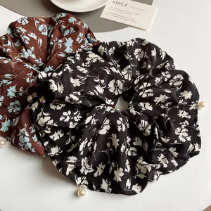 Floral print large scrunchies with white pearl charms in brown and black chiffon fabric