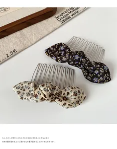 Close-up of floral bow hair combs with ten metal teeth for daily styling and hair fixing