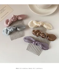 Detailed view of satin bow hair side combs in multiple colors with metal teeth