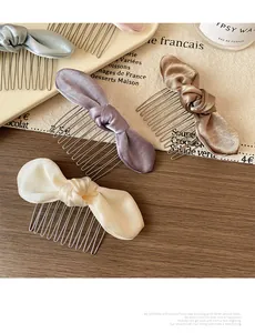 Satin bow hair side combs in blue purple brown and beige colors on table