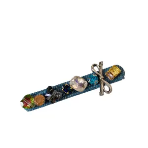 Sparkling rhinestone denim hair clip featuring colorful crystals and a silver bow detail