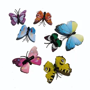 Detailed close-up of 7 colorful 3D butterfly hair clips with realistic printed wing textures