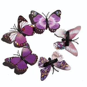 Set of five purple and pink butterfly hair clips with realistic wings and duckbill clips
