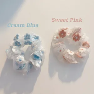 Detailed embroidery flowers on pink and blue organza mesh fabric scrunchies