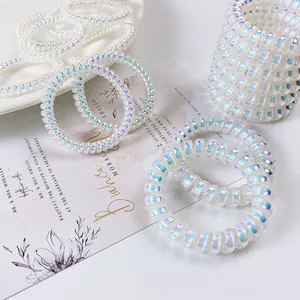 Elastici per capelli a spirale stile sirena cangiante con fiocco su vassoio di ceramica