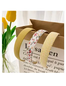 Three-piece headband set featuring vintage floral, plaid, and solid ginger fabric designs
