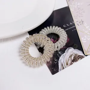 Minimalist spiral telephone wire hair ties with gold beads and transparent elastic bands