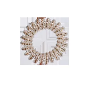 Korean style spiral telephone wire hair tie with embedded gold decorative beads