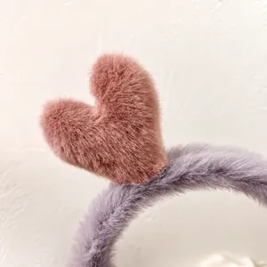 Plush deer antler headband in soft pink and purple, cute hair accessory for women