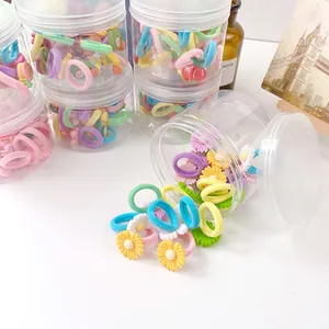 Set de gomas de pelo de colores macarrón con dijes de resina en bote para niñas