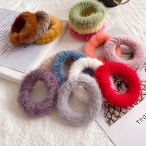 Faux rabbit fur scrunchies set in vibrant candy colors for cozy winter hair styling