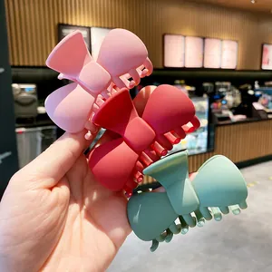 Three-piece set of large matte bow hair claws in pink, red, and morandi green