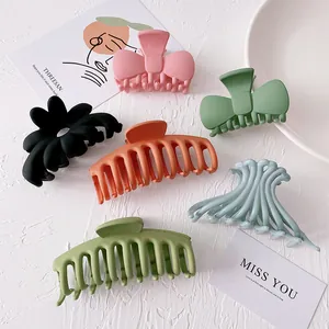 Set of large candy-colored matte hair claws in various shapes and morandi tones