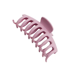 Large matte candy-colored hair claw clip in elegant pink for thick hair styling