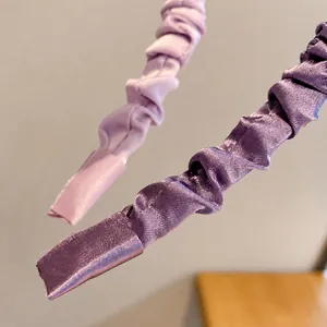 Elegant solid color pleated satin headbands in light and dark purple silk textures