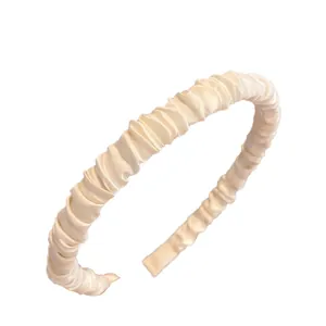 Elegant cream satin pleated headband with ruffled fabric texture for women's hair styling