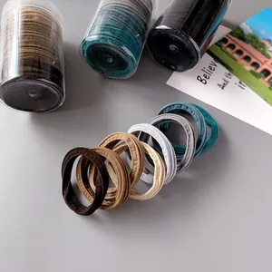 High-elasticity nylon hair tie set in earthy tones with minimalist cylindrical packaging