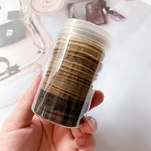 Neutral earth tone seamless elastic hair ties set in a clear cylindrical container