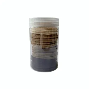 Set of seamless nylon hair ties in earth tones stored in a clear cylindrical container