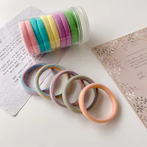 Seamless high elasticity hair ties in macaron colors displayed in a clear plastic jar