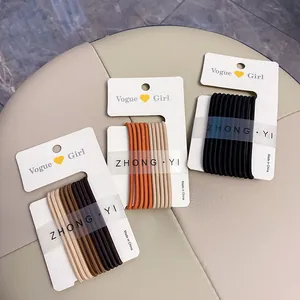 Set of high-elasticity hair ties in earth and candy tones on minimalist cards