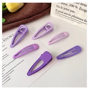 Detailed close-up of a 6-piece purple gradient matte metal hair clip set for girls