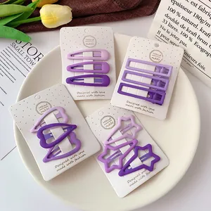 Purple gradient matte hair clip set including heart, star and drop shapes on display card