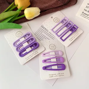 Purple matte hair clip set including rectangle and oval shapes on display card