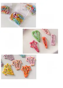 Detail of candy-colored polka dot hair clips in various shapes with a storage box
