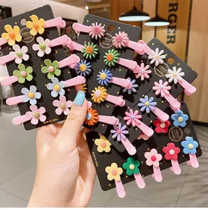 Close-up of colorful flower hair clips set on display cards for girls and kids